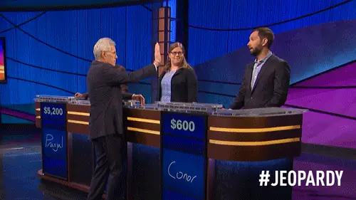 On Jeopard, host Alek Trebek gives an awkward high-five to a contestant