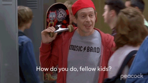 Steve Buscemi with a "Music Band" t-shirt and skateboard. Caption says "How do you do, fellow kids?"