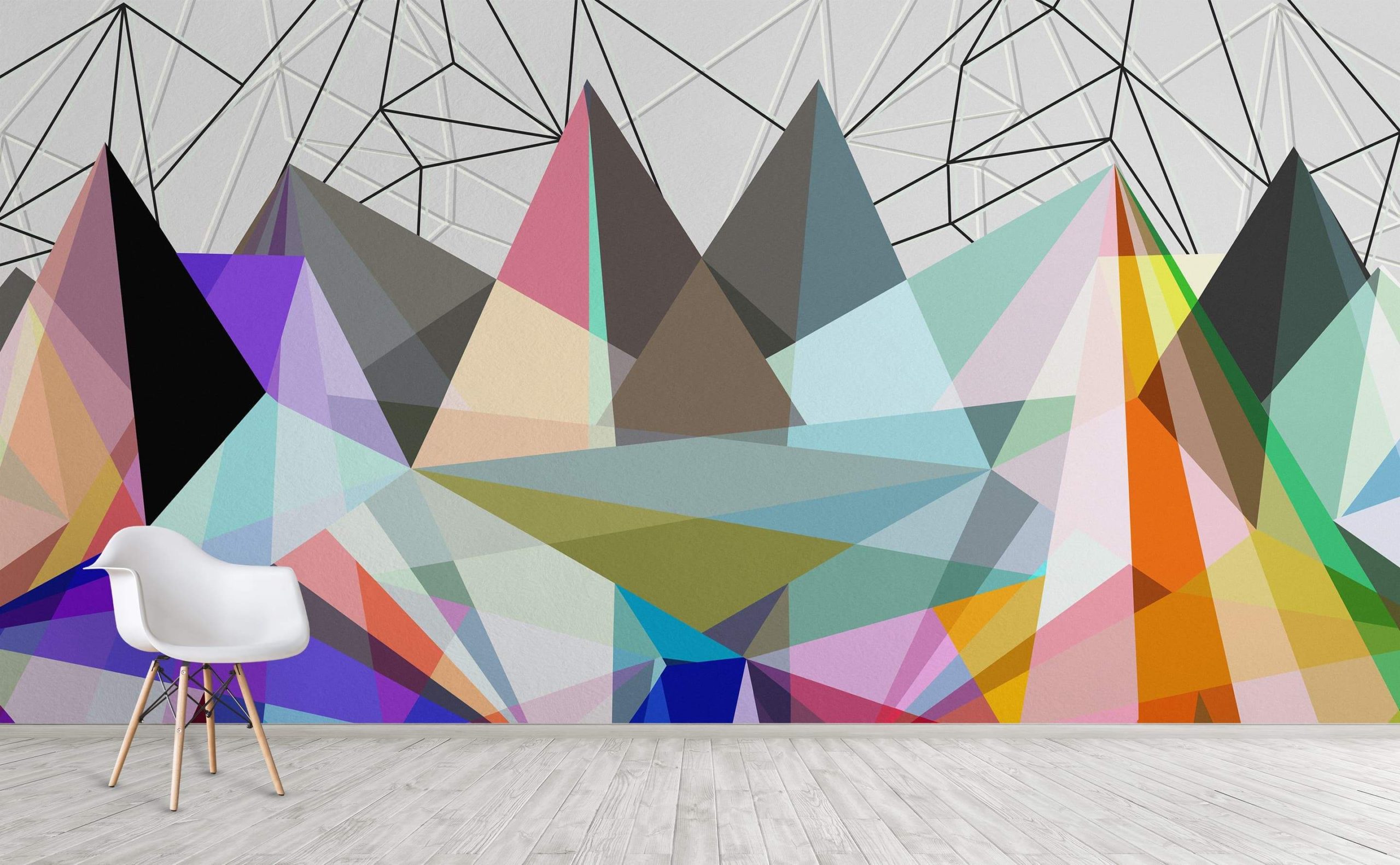 A geometric mural behind a table and chairs