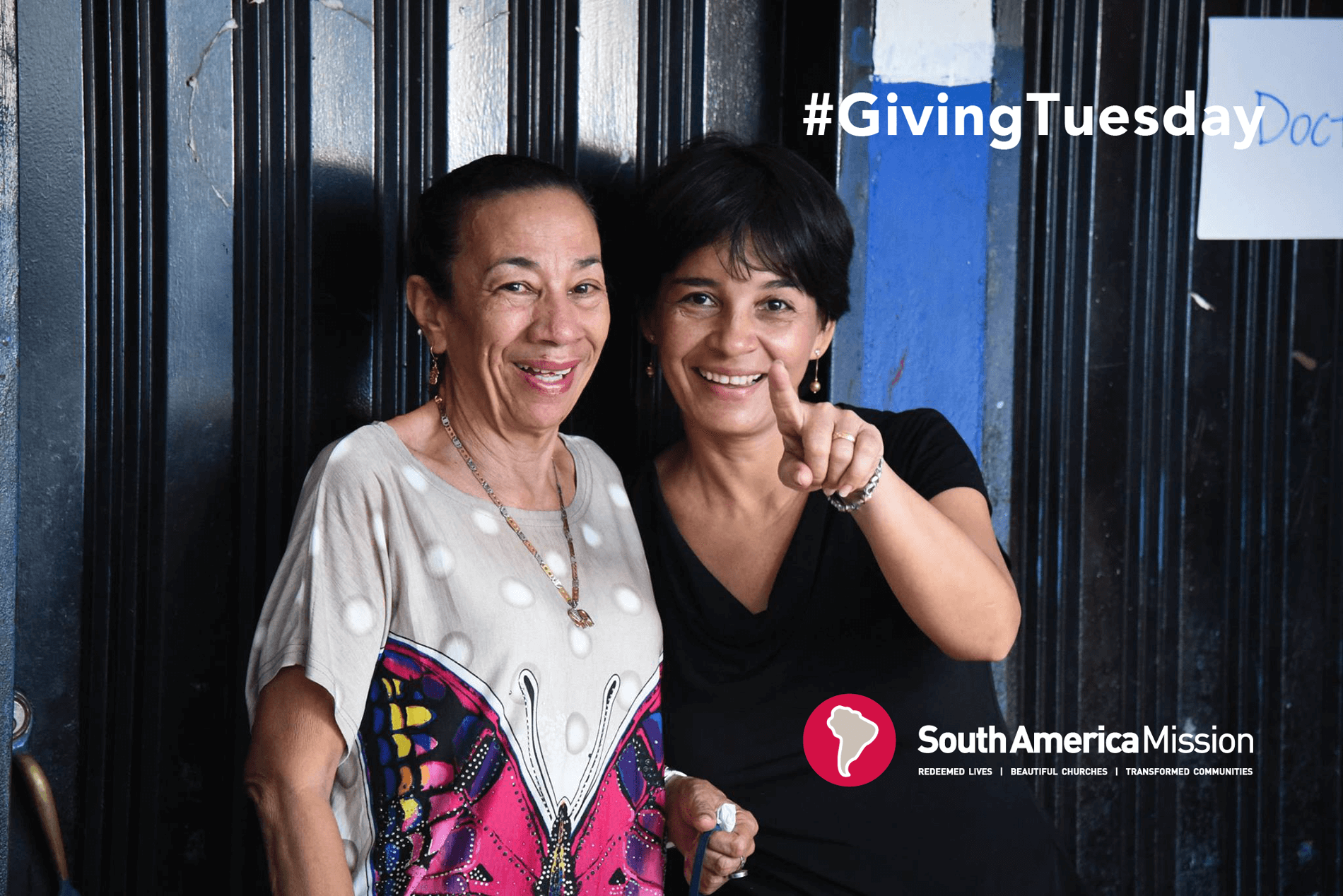 Two hispanic women smile in a graphic with the hashtag #GivingTuesday